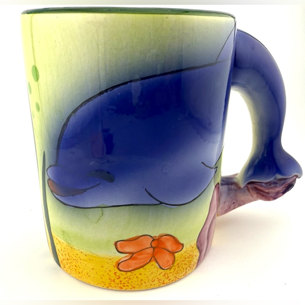 Dolphin mug with a tail handle. 14oz